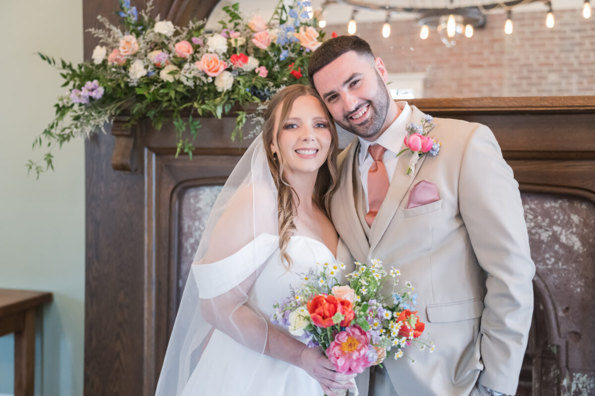 Bride and groom embracing during intimate pop-up wedding at Company 421 in Mahomet